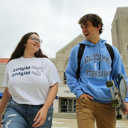 Immaculata University Traditional Undergraduate Studies - 2 students talking walking to class